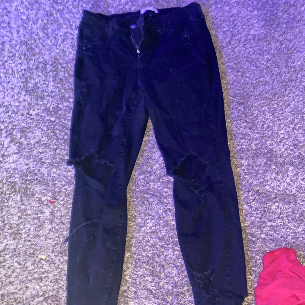 Black new jeans with holes in knees